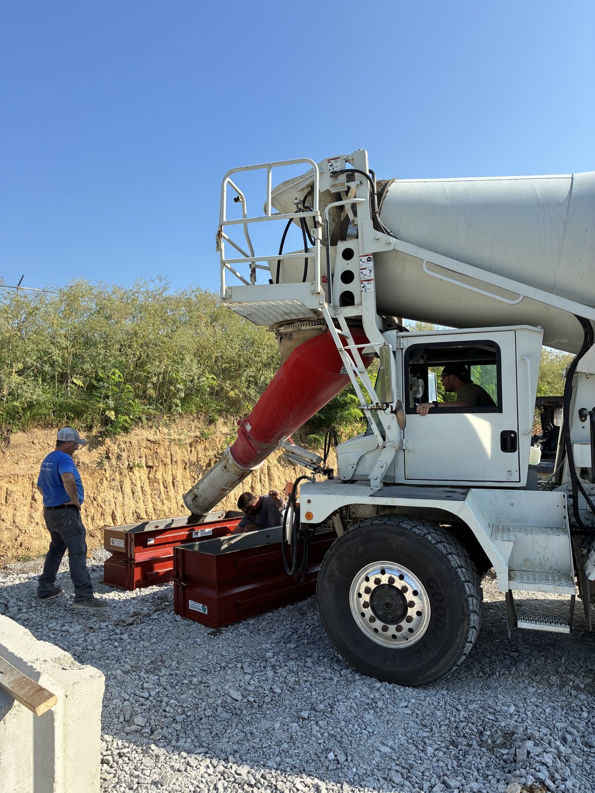 Kelley Ready Mix white mixer pouring ready-mix concrete into forms in Greater Cincinnati