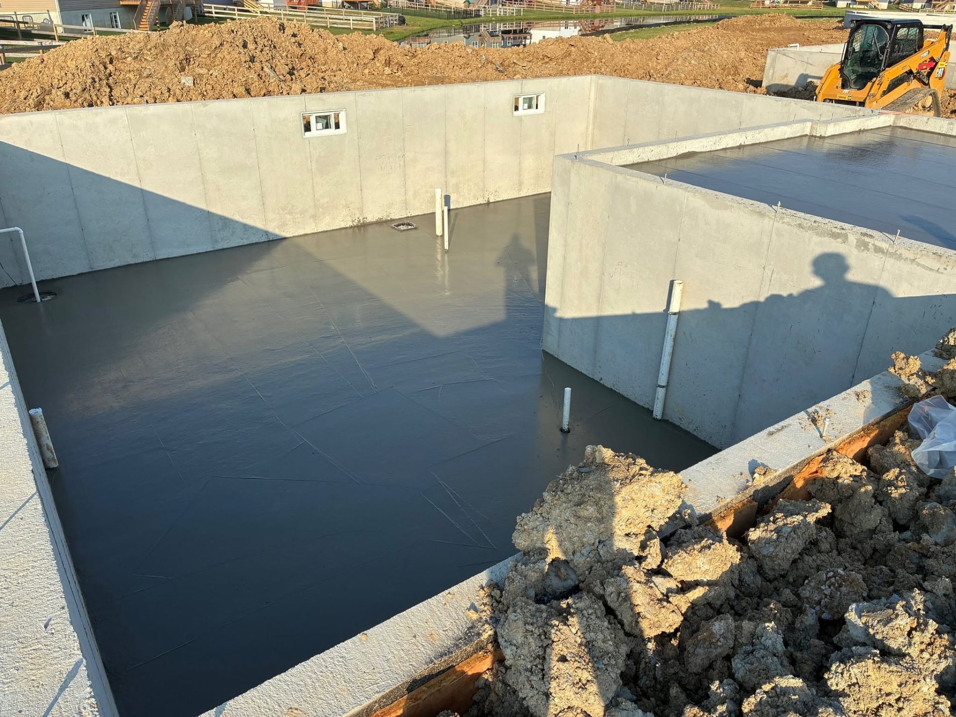 Kelley Ready Mix ready-mix concrete being placed in a footing form on a Batavia, OH jobsite